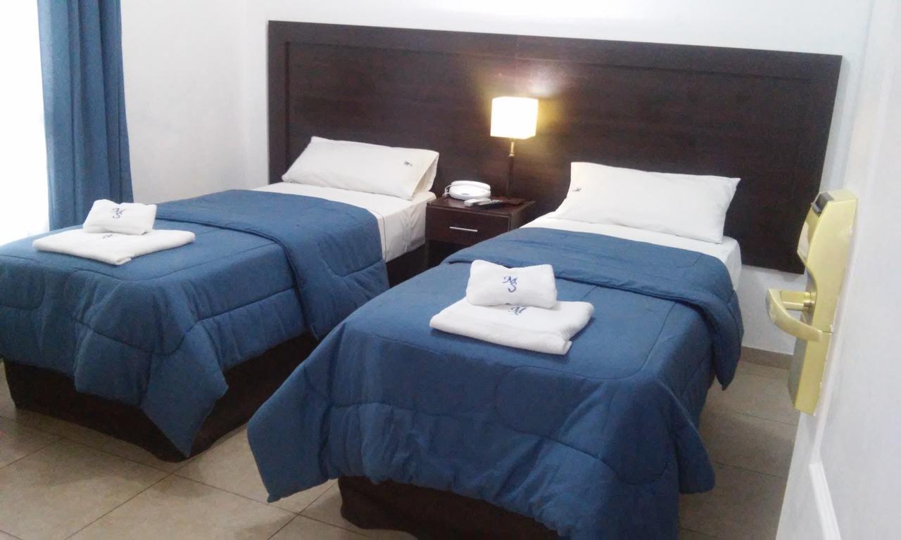 Morada Suites Campana Esterno foto